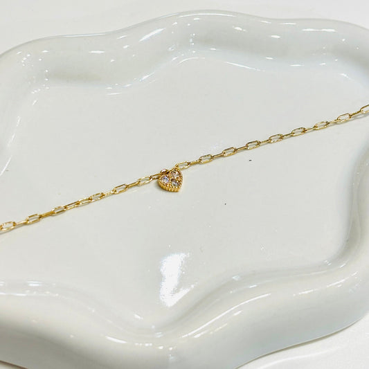 Bracelet Idylle plaqué or Gris Collection
Plaqué or et zircons 
Possède des anneaux de rappel
Gris Collection 
Gris Bijoux bijouterie Paris 16