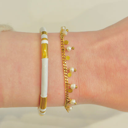 Bracelet Poema en acier inoxydable
Pampilles dorées et perles d'imitation
