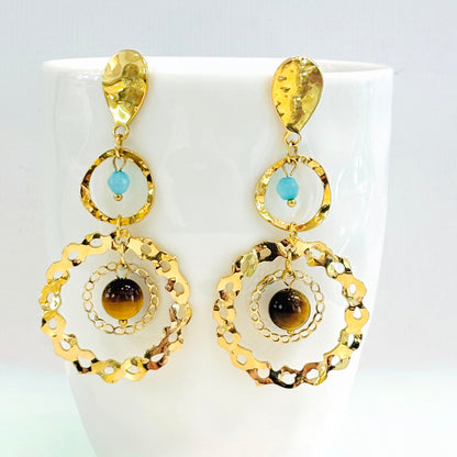 Boucles d'oreilles pendantes acier inoxydables doré et oeil de tigre, perles bleues
Boucles d'oreilles percées tendance été 2026