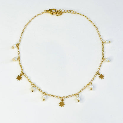 Bracelet de cheville acier inoxydable doré et pampilles en véritables perles d'eau douce, charms doré en forme d'étoiles
Bracelet de cheville doré acier inoxydable ajustable 
Bracelet de cheville tendance été 
Chaine de cheville acier inoxydable doré été charms perles d'eau douce blanches
Bracelets de cheville paris 
Bracelets de cheville acier inoxydable paris bijouterie paris 16