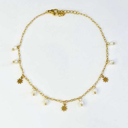 Bracelet de cheville acier inoxydable doré et pampilles en véritables perles d'eau douce, charms doré en forme d'étoiles
Bracelet de cheville doré acier inoxydable ajustable 
Bracelet de cheville tendance été 
Chaine de cheville acier inoxydable doré été charms perles d'eau douce blanches
Bracelets de cheville paris 
Bracelets de cheville acier inoxydable paris bijouterie paris 16