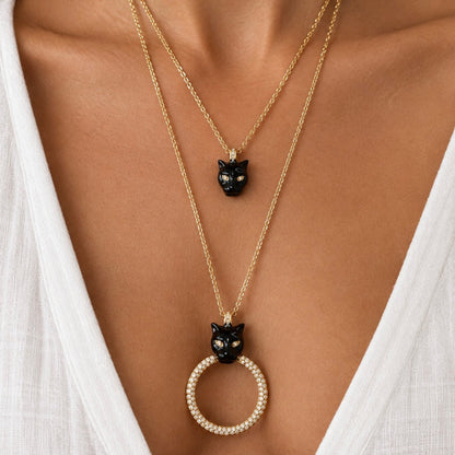 deux sautoirs polina firenze plaqué or 24 carats et émail noir 
